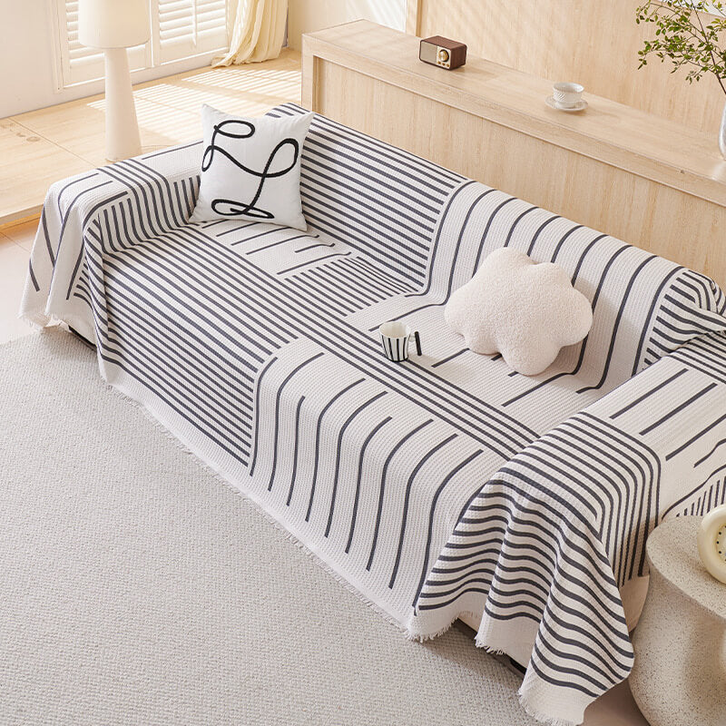 Cover di divano multicolore del modello geometrico - design moderno per una casa elegante